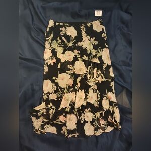 Long skirt with ruffles, black with pink flowers